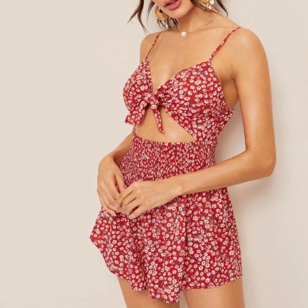 Red romper with small white flowers tie in front